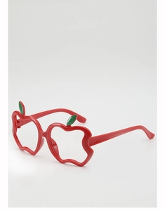 Macro detail of red apple shaped glasses frame with leaf accent for kids party props