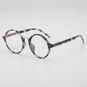 Vintage round grey marble frames with gold metal accents and tricolor temple tips