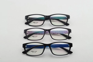 Flat lay view of three colorful TR90 square glasses frames in black and green, purple, blue