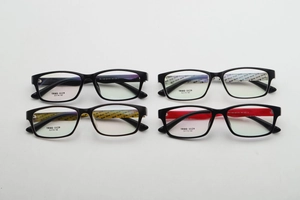 Detail view of square TR90 eyeglass frames showing diverse inner temple patterns and colors