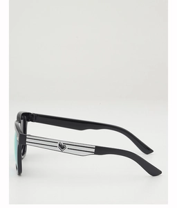 Detail of black sunglasses frame with green mirrored lenses and silver heart flame accent