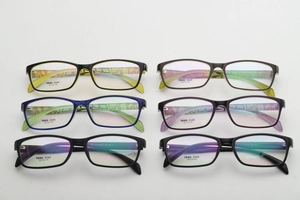 Detail shot of multi-color TR90 square optical frames showing temple texture and 54-16-145 size