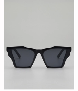 Front view of modern black thick-frame cat-eye sunglasses with dark grey lenses