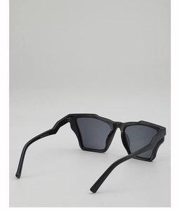 Detail view of wavy geometric sunglasses frame with V8244 specifications on temple