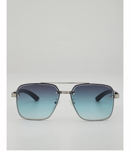 Détail de lunettes aviateur à double pont avec verres dégradés bleus et rivets métalliques
