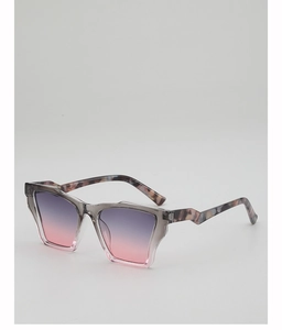 Detail view of cat eye sunglasses featuring purple gradient lenses and tortoiseshell temples
