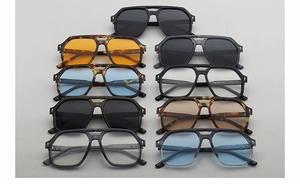 Flat lay view of assorted aviator sunglasses featuring various frame colors and tinted lenses