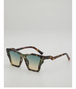 Detail of tortoiseshell geometric cat eye sunglasses with orange gradient lenses