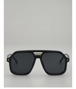 Detail of pilot sunglasses showing the square black frame and silver metal bridge accent
