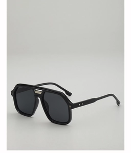 Detail view of navy aviator sunglasses featuring silver metal bridge and arrow accents