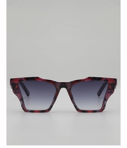 Detail of geometric leopard print sunglasses with red and black tortoiseshell frames