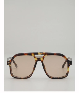 Detail of tortoise shell aviator sunglasses with metal bridge and diamond rivets