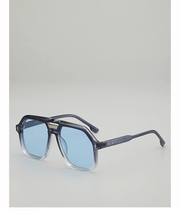 Macro detail of navy aviator sunglasses showing blue lenses and metallic bridge texture