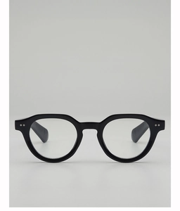Detail of vintage black acetate glasses frame showing classic metal rivets and hinges