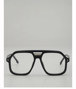 Close-up of navy pilot sunglasses with double-bridge frame and silver diamond rivets