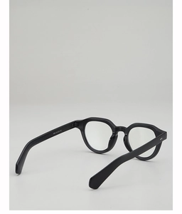 Detail view of black polygon eyeglass frames with silver size specifications on temples