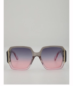 Detail of square oversized sunglasses with gradient lenses and gold temple accents