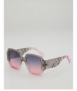 Detail of square oversized sunglasses with grey-pink gradient lenses and faceted temple design