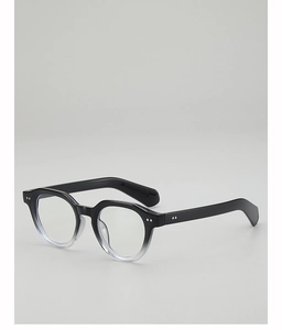 Macro detail of retro black gradient eyewear frame with signature double metal rivets