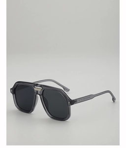 Detail of transparent gray aviator sunglasses with metal hinge accents and nose bridge