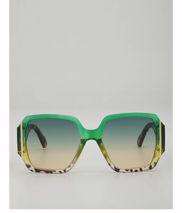 Detail of square gradient green and yellow frames with tortoiseshell pattern and gold accents