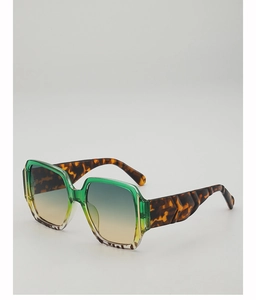 Detail of square oversized sunglasses featuring gradient lenses and tortoise shell temples