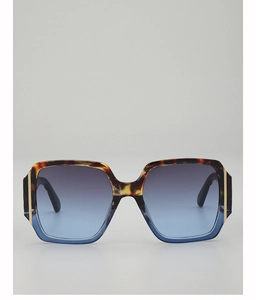 Close-up of tortoise and blue gradient square frames with elegant gold metal hinge detail