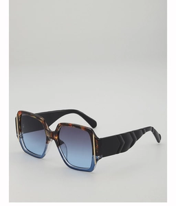 Detail of tortoise and blue gradient square frames with textured wave wide temples