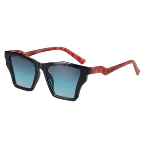 Green leopard cat-eye sunglasses with wavy black frames and brown tortoiseshell temples