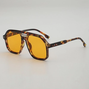 Retro aviator sunglasses with tortoise frame and orange lenses in a 45-degree side view