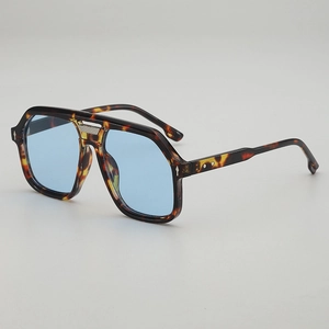 Retro pilot sunglasses with navy tortoise frame and light blue lenses for women
