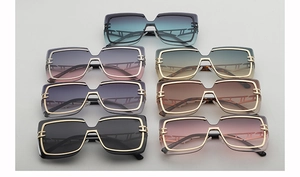 Detailed display of trendy oversized square sunglasses with gradient lenses and metal frames