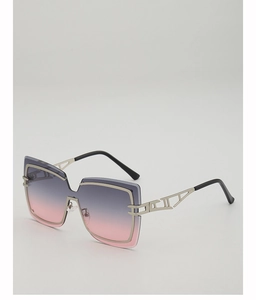 Detail of silver geometric hollow temples and gradient lenses on oversized sunglasses