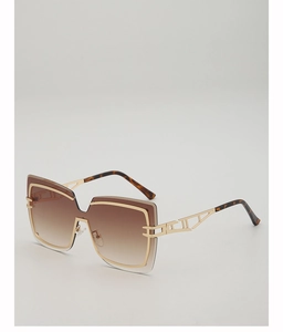 Macro view of geometric sunglasses featuring hollow metal temples and gradient brown lenses