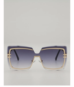 Detail of oversized square sunglasses with gold metal trim and purple gradient lenses