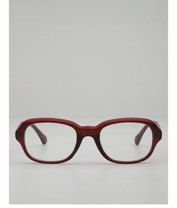 Gros plan de lunettes rétro bordeaux à monture épaisse avec une finition polie