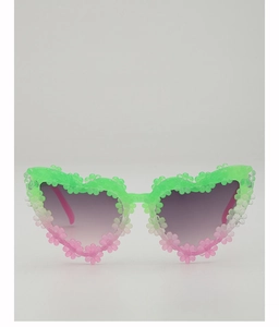 Detail of heart-shaped sunglasses with 3D floral accents and green-pink gradient frame
