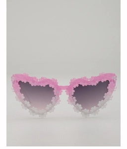 Close-up of heart-shaped kids sunglasses with pink daisy flowers and purple gradient lenses