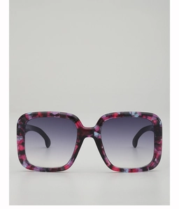 Detailed close-up of large square frames with a colorful mottled pattern and gradient lenses