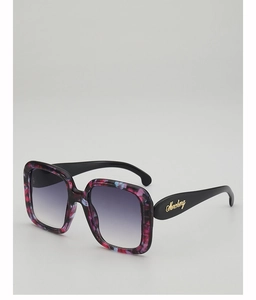 Detail of square oversized marble texture frame with purple gradient lenses and logo