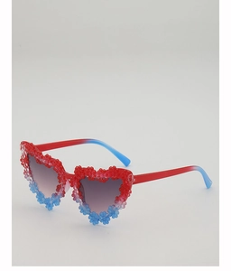 Detailed view of heart-shaped sunglasses with red and blue floral pattern accents