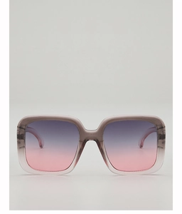 Detail of oversized square sunglasses with grey-purple frame and gradient lenses
