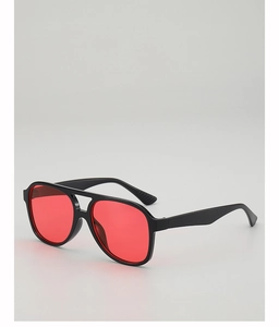 Detail of vintage aviator sunglasses with black plastic frame and red tinted lenses