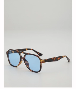 Detail of tortoiseshell aviator sunglasses featuring a double bridge and blue tinted lenses