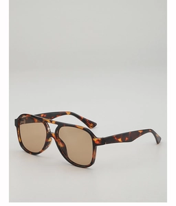 Detail view of double bridge tortoise shell sunglasses with retro brown tinted lenses