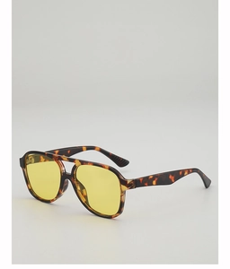 Detail of tortoise frame aviator sunglasses with yellow lenses and double bridge design