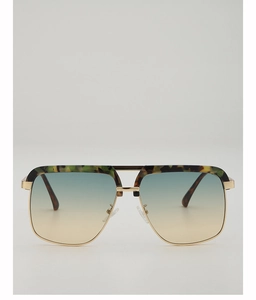 Detail of pilot sunglasses showing green tortoiseshell frames and gradient blue lenses