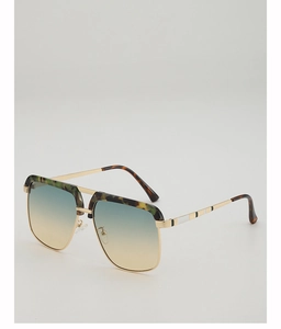 Detail of gold metal aviator sunglasses with gradient lenses and tortoise shell patterns