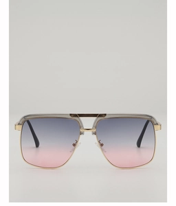 Macro shot of gold metal frames with gradient grey lenses and unique double bridge design