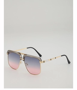 Detail of gold metal frame sunglasses with purple-pink gradient lenses and sleek double bridge